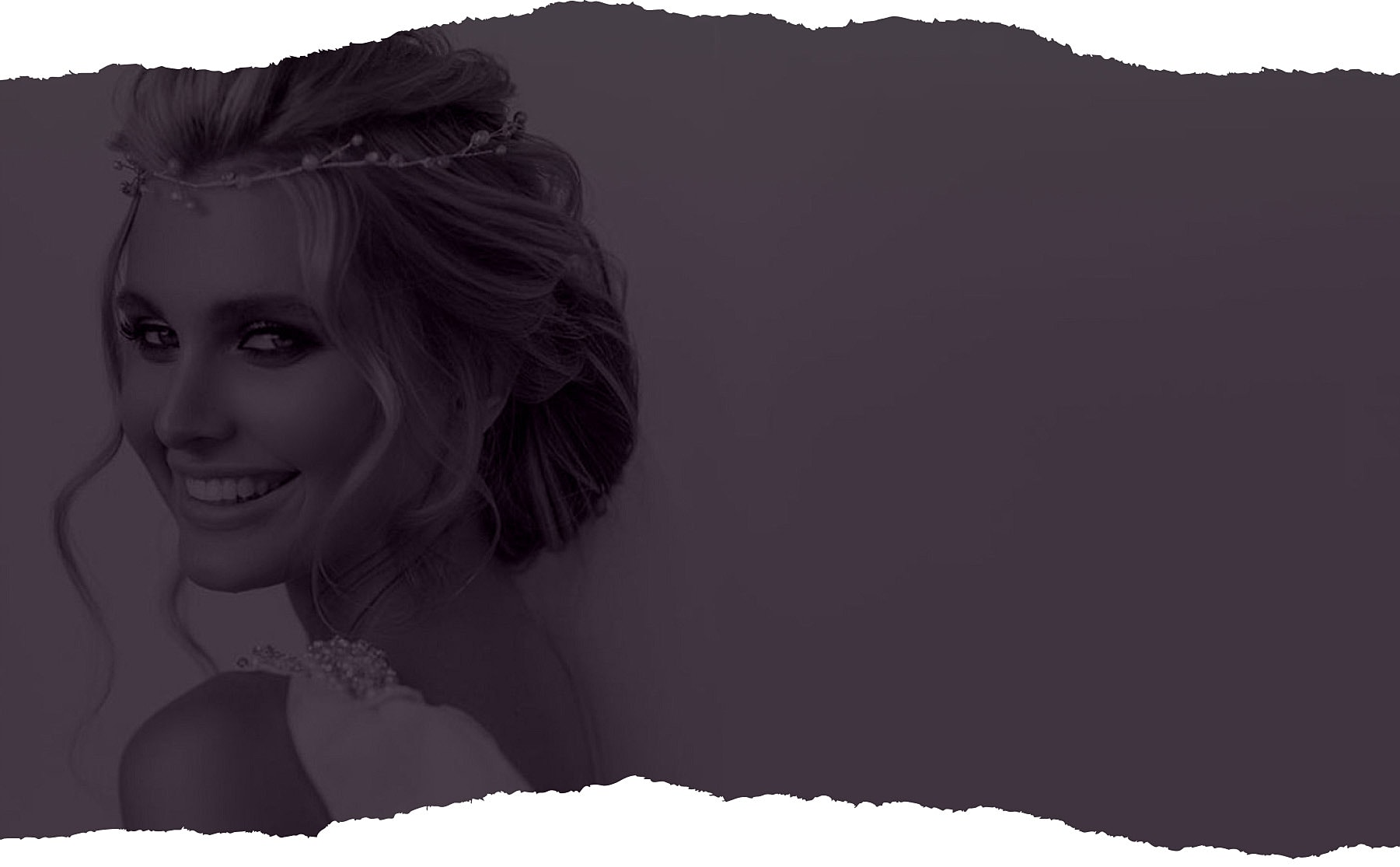 Smiling woman with flowing hair and crown.