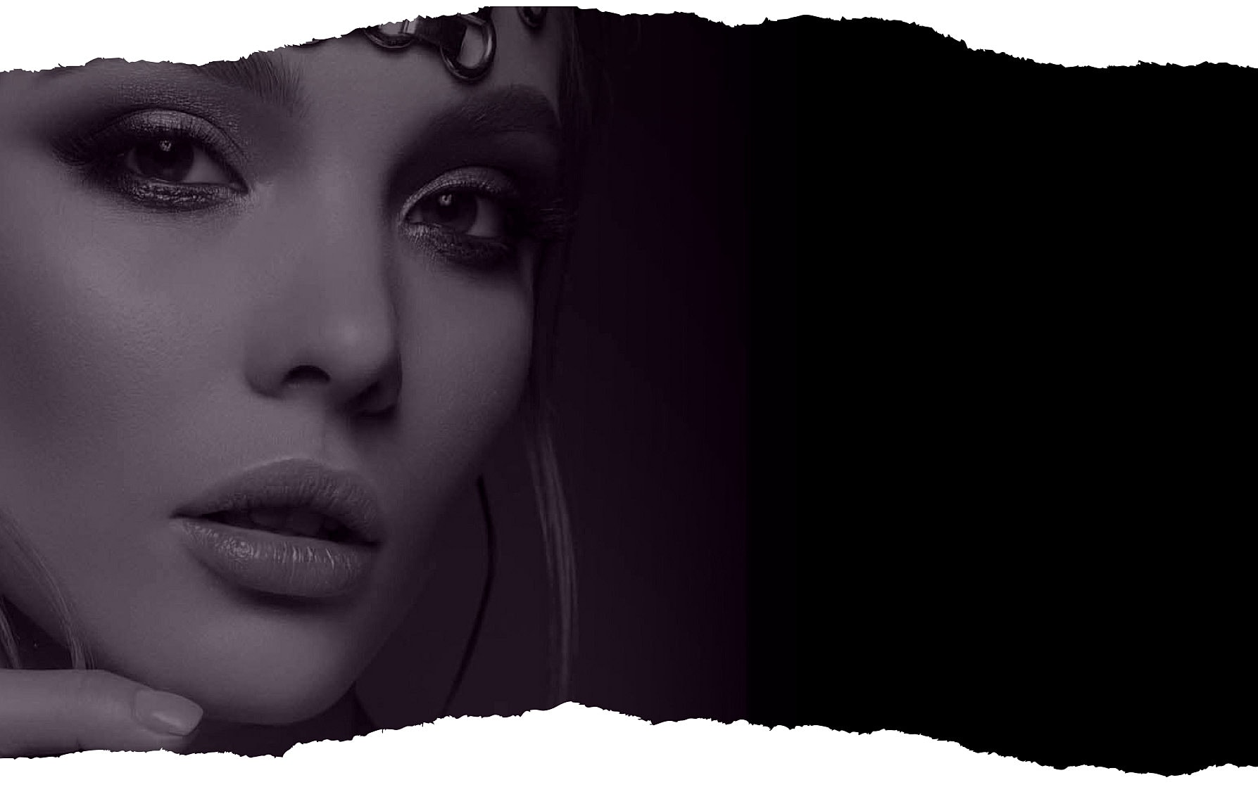 Close-up of a woman's face with dramatic lighting.