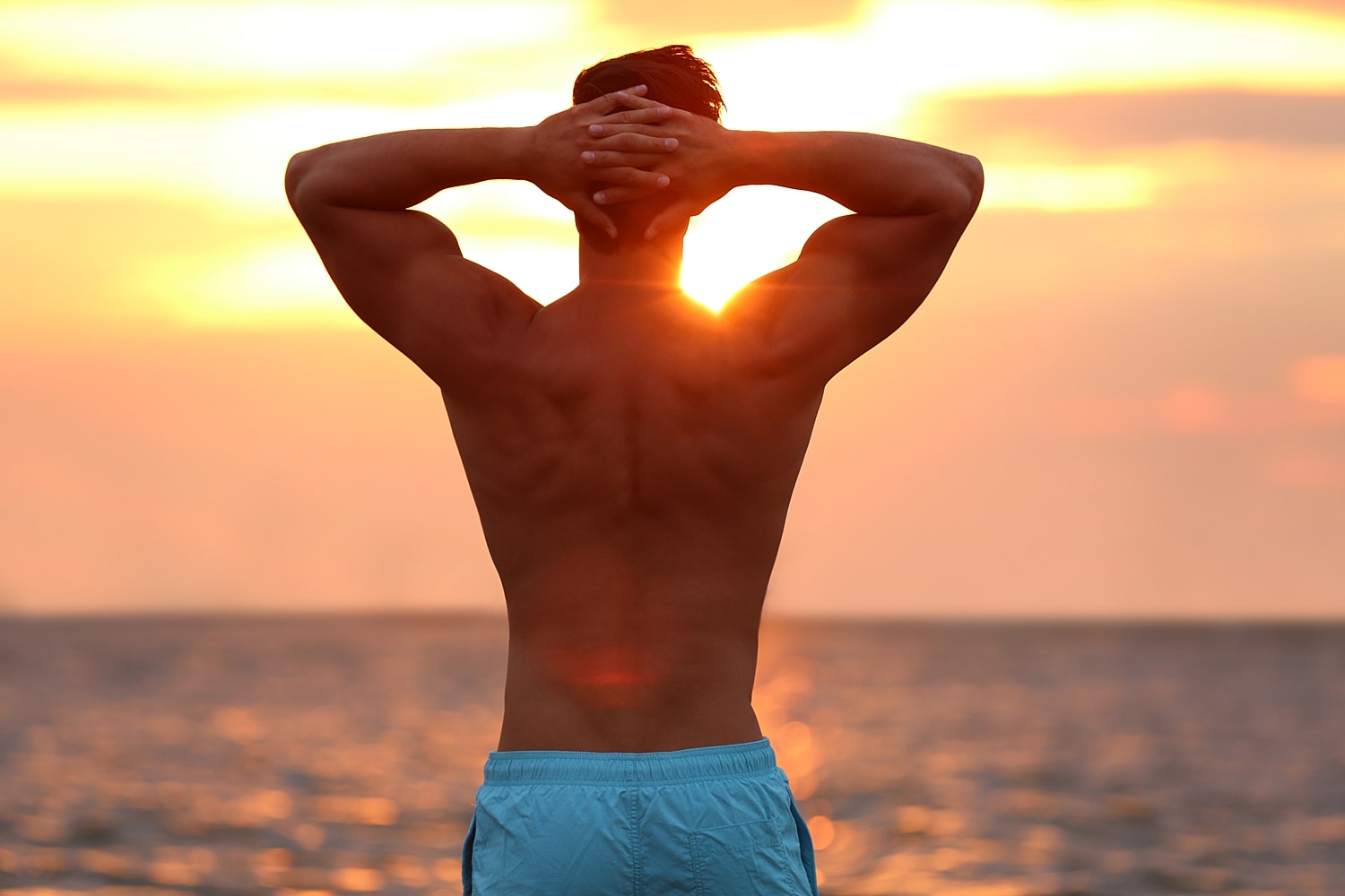 Man enjoying sunset by the ocean.