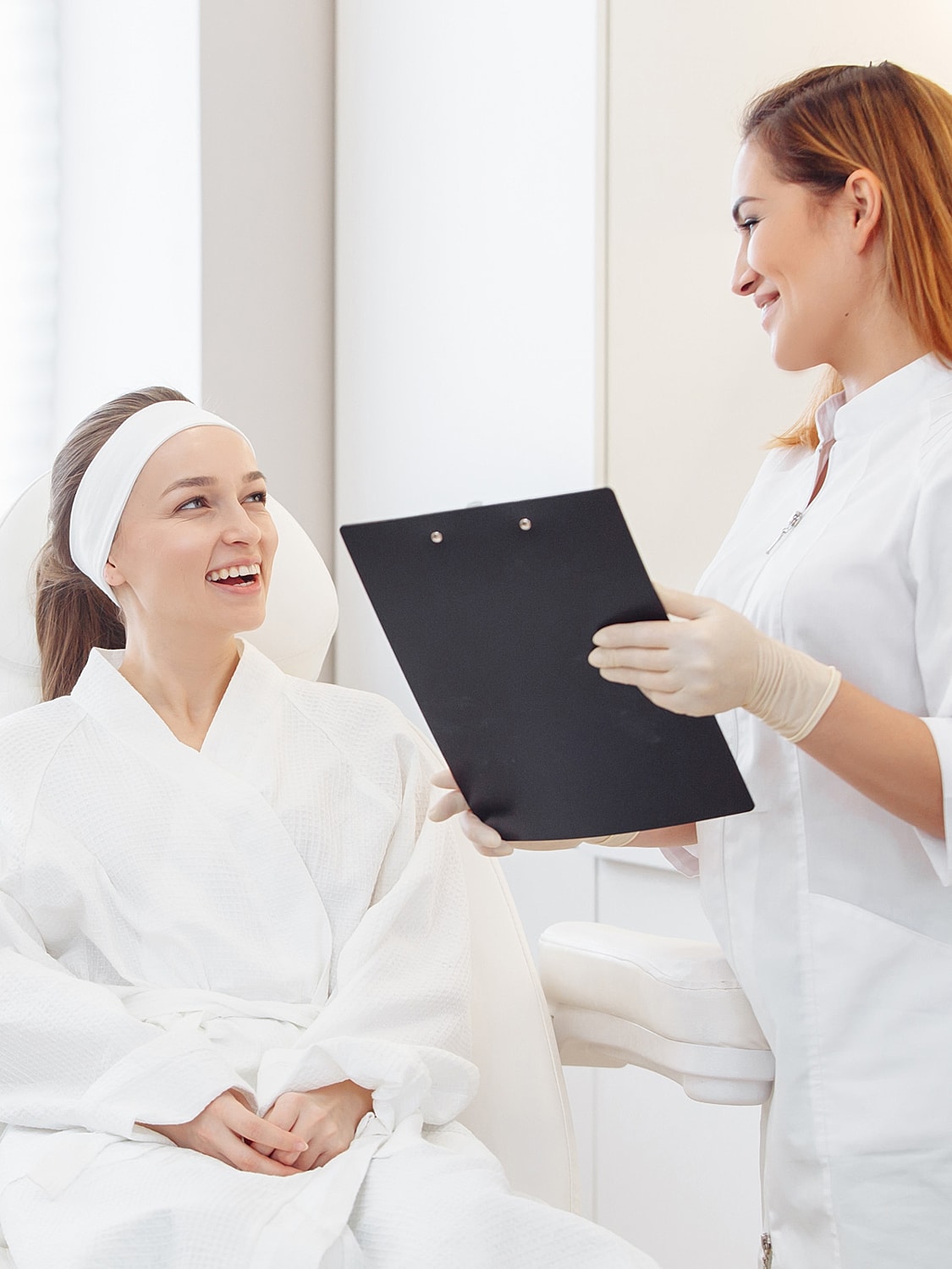 Patient consultation in a skincare clinic setting.