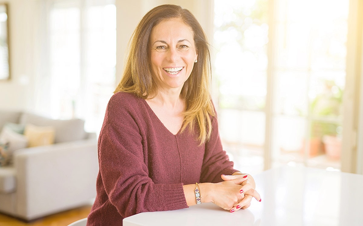 Smiling woman at home, enjoying her morning.