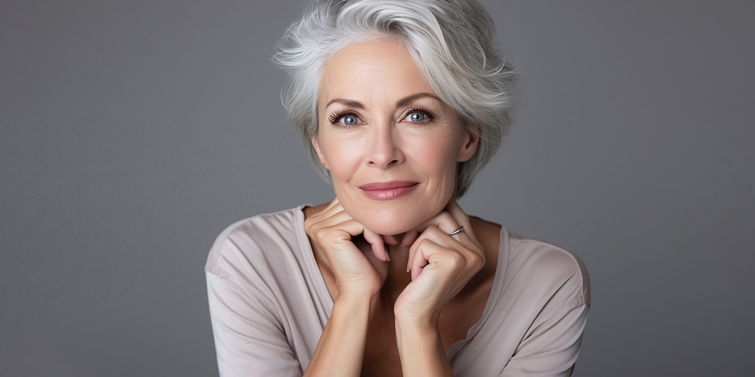 Portrait of a thoughtful mature woman smiling.