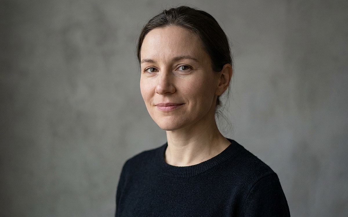 woman posing to the camera with dark background