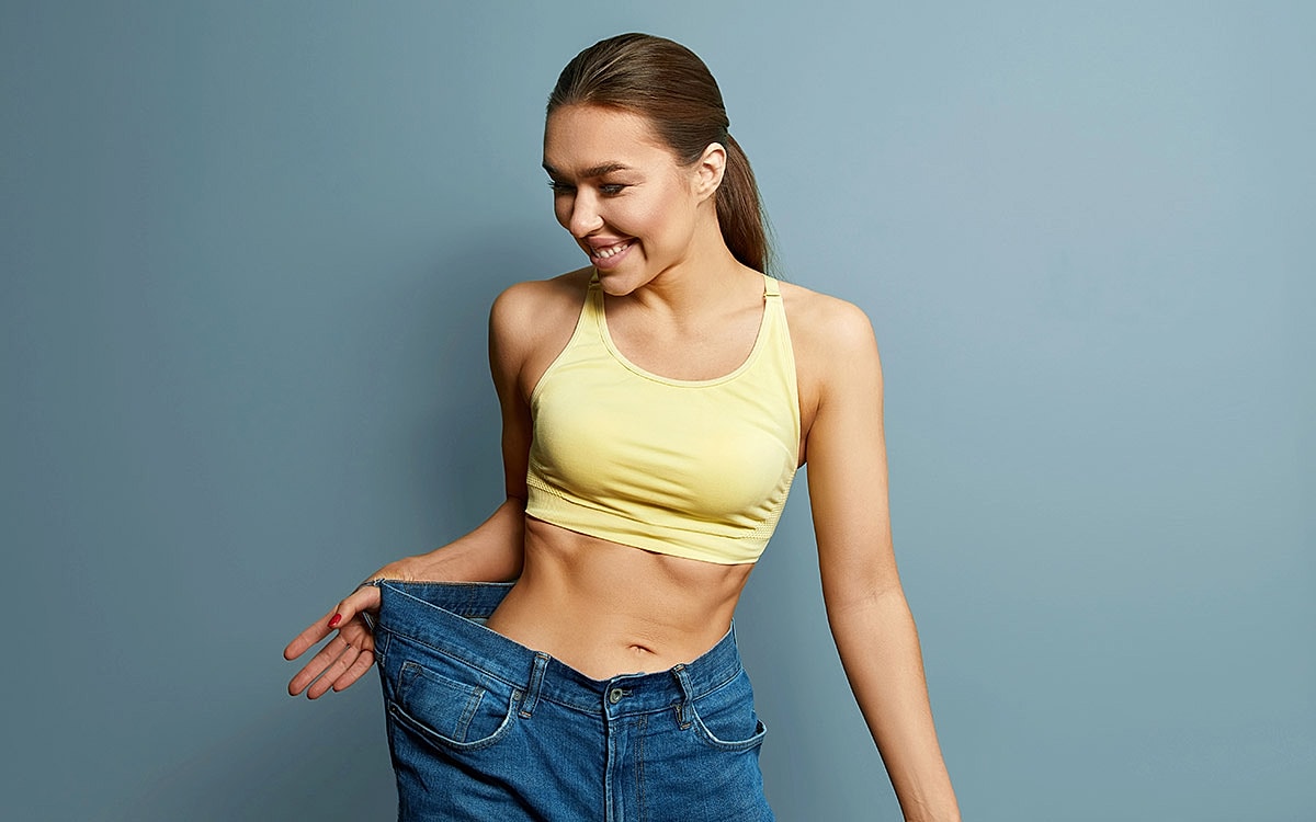 woman smiling after weight loss journey