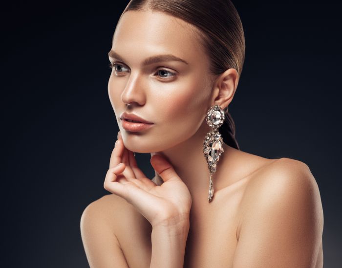 Model showcasing elegant jewelry and beauty.