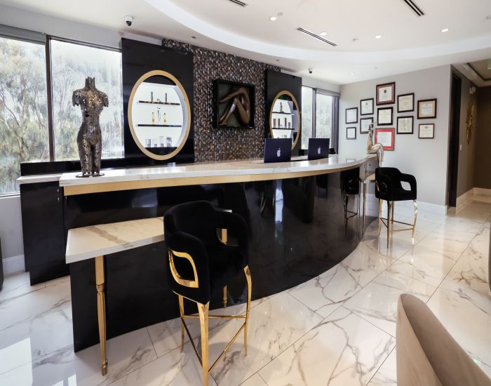 Modern aesthetic clinic reception area with decor.